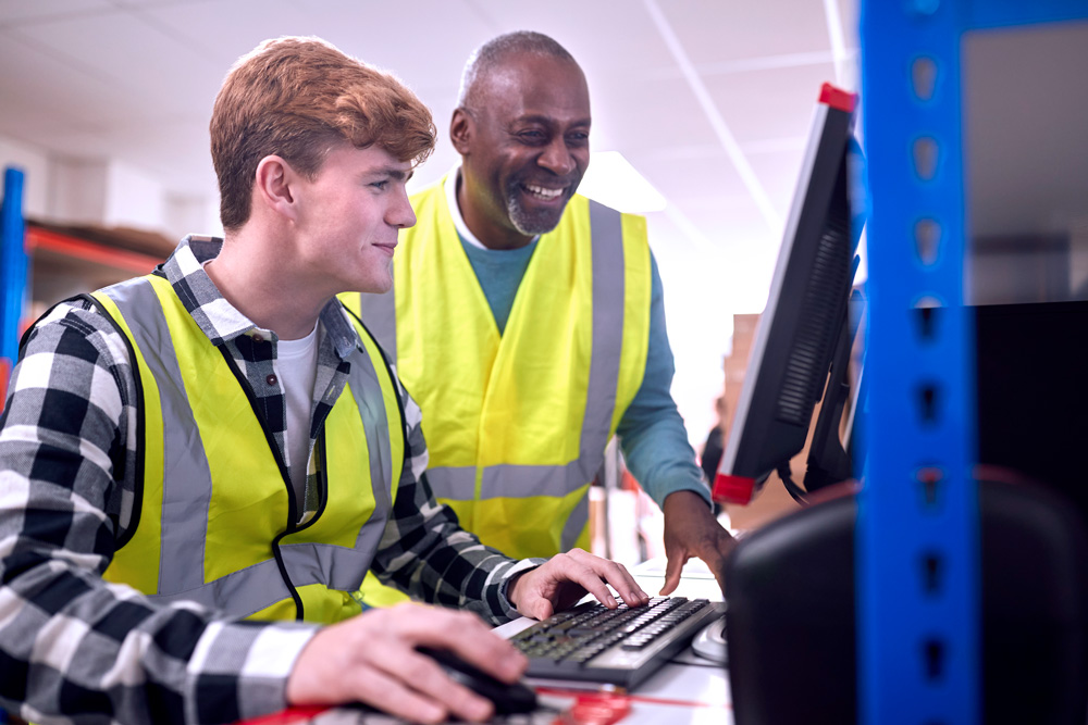 mentor and mentee working in warehouse setting